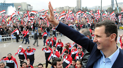 Syrian president ASSAD waves to supporters during a recent rally