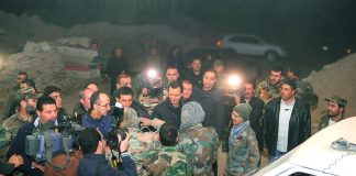 Syrian president BASHAR AL-ASSAD visiting troops on the front line on New Year’s Eve