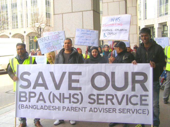 ‘Mayor come down! Don’t cut our service!’ shouted families fighting against cuts to the disability service outside Tower Hamlets Town Hall yesterday lunchtime