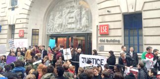 Students demonstrate outside the London School of Economics where they have been occupying since March 17