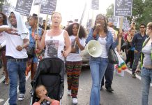 CAROL DUGGAN (centre) with MARCIA RIGG (right) marching in Tottenham