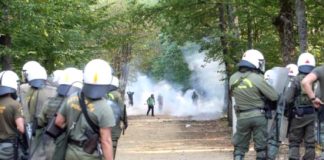 Riot police attacking villagers with tear gas in Skouries, northern Greece. Photo left.gr