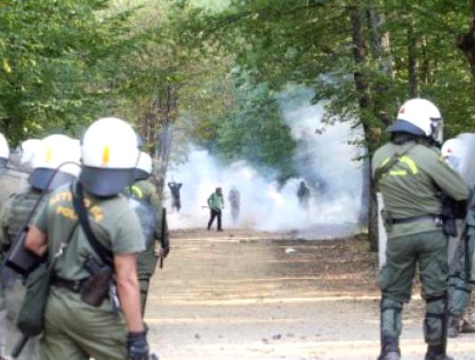 Riot police attacking villagers with tear gas in Skouries, northern Greece. Photo left.gr
