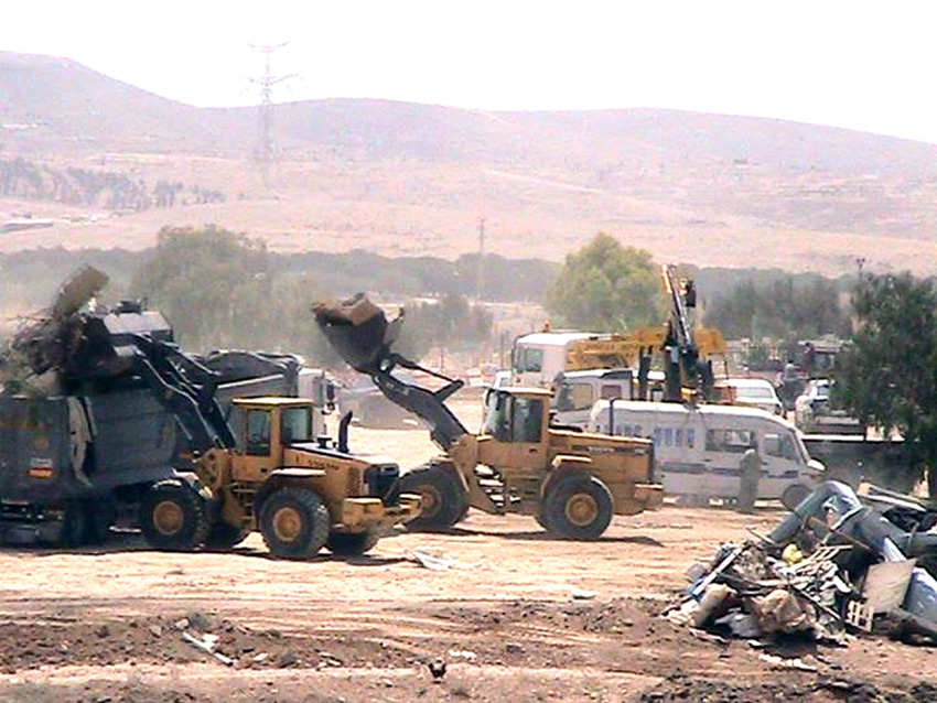 Israeli bulldozers at work demolishing the Bedouin village of al-Araqib in the Negev