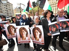 Palestinian demonstrators call to free Palestinain leader Khalida Jarrar