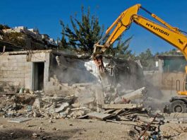 Israeli bulldozers razing the homes of Palestinians