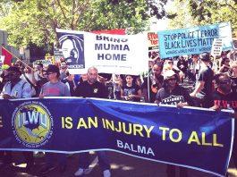 END LOW PAY – END POLICE OPPRESSION – demand US May Day marchers The Oakland May Day march against police brutality and killings which has come together with trade unions . Workers are fighting for their rights