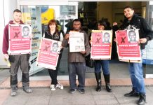 SCOTT DORE (centre), WRP candidate for Acton and Ealing Central with supporters campaigning outside Acton College on the final day before polling