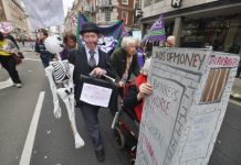 Marchers on a TUC demonstration against austerity demand jail for the bankers