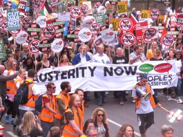 Hundreds of thousands march against austerity! – WHILE LEADERS LIMIT DEMANDS TO ‘TURNING TORIES BACK’ The lead banner ‘End Austerity Now’ is carried by trade union leaders, including Unite’s Len McCluskey (centre)
