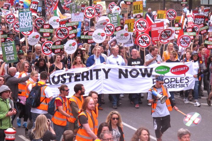 The lead banner ‘End Austerity Now’ is carried by trade union leaders, including Unite’s Len McCluskey (centre)