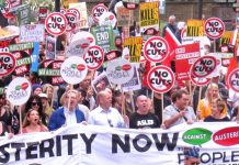 MICK WHELAN, Aslef general secretary (ASLEF T-shirt) and Unite leader LEN McCLUSKEY (3rd from left) at the front of the National Austerity Protest last