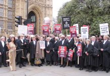 Barristers and solicitors demonstrated outside Parliament during a strike last year against legal aid cuts