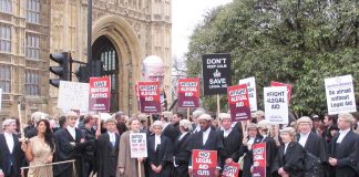 Barristers and solicitors demonstrated outside Parliament during a strike last year against legal aid cuts
