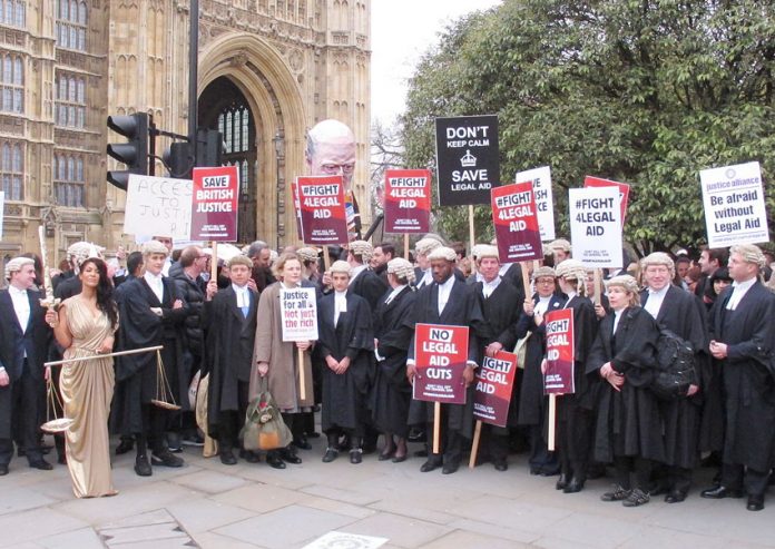 Barristers and solicitors demonstrated outside Parliament during a strike last year against legal aid cuts