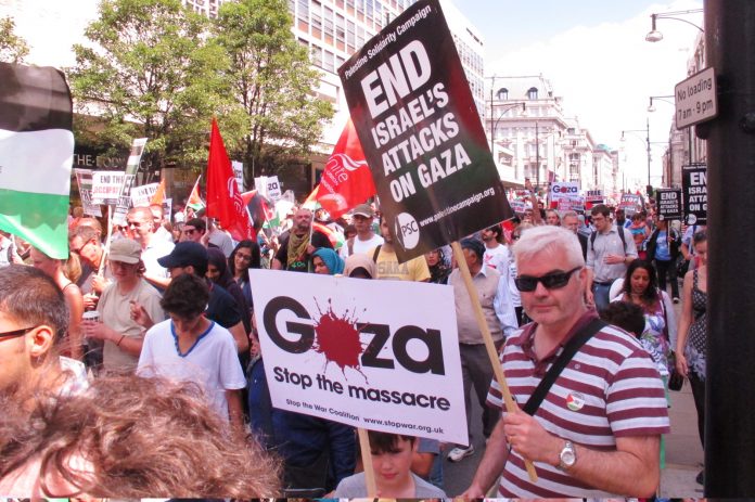 Marchers in London condemning Israeli war crimes in Gaza
