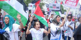 Young people marching to the Israeli Embassy in London to denounce Israeli war crimes in Gaza