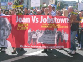 Banner on Saturday’s march condemning Labour leader Joan Burton after scores of water charge demonstrators were arrested in Jobstown last November
