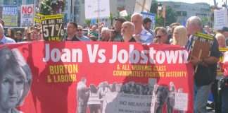 Banner on Saturday’s march condemning Labour leader Joan Burton after scores of water charge demonstrators were arrested in Jobstown last November