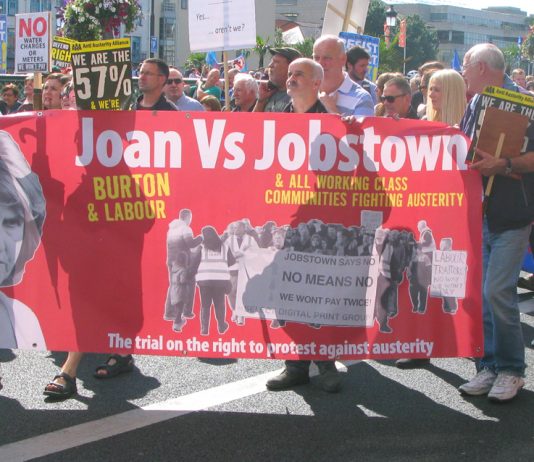 Banner on Saturday’s march condemning Labour leader Joan Burton after scores of water charge demonstrators were arrested in Jobstown last November