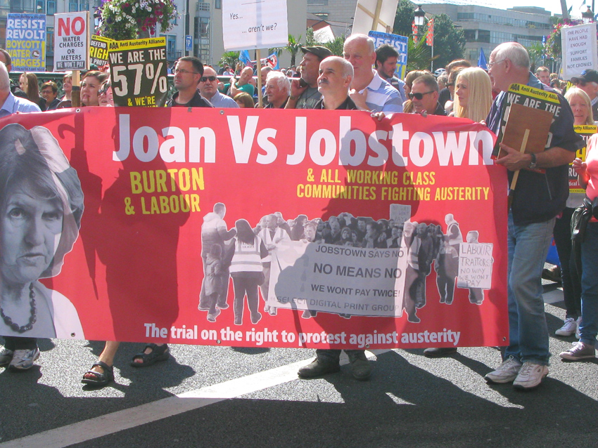 Banner on Saturday’s march condemning Labour leader Joan Burton after scores of water charge demonstrators were arrested in Jobstown last November