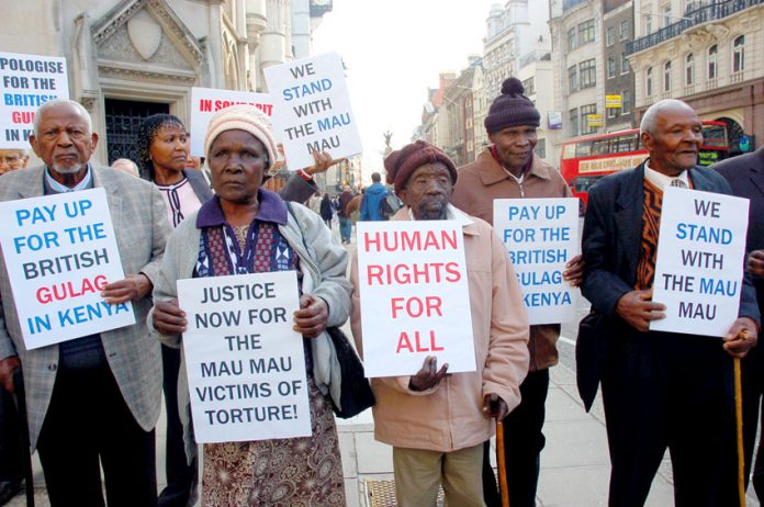 Kenyan Mau Mau veterans picket the law courts in the Strand as a successful legal case is brought against the UK government