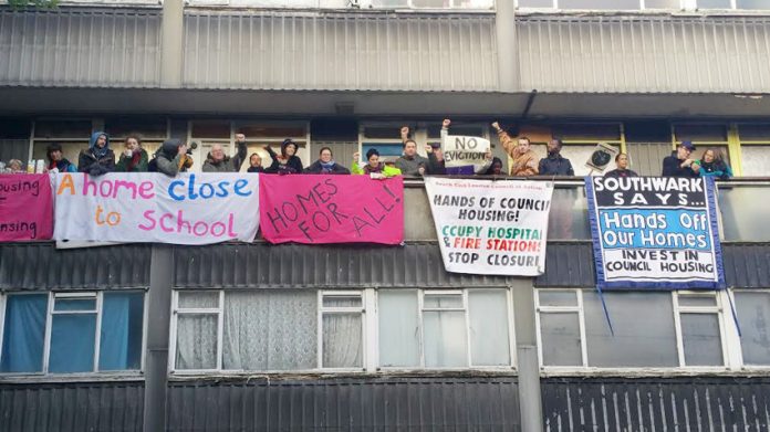 Over 60 local residents, supporters and youth massed on the balcony yesterday morning in Southwark to stop the eviction of Aminata Sellu by bailiffs supported by the police