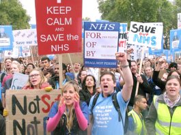Some of the 20,000 Junior Doctors rallying in central London on Saturday display their defiance in the face of Health Secretary Hunt’s attack on their contract