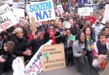 South African students in a sit-down protest outside the South African embassy demanded an end to police brutality against protesting students in South Africa