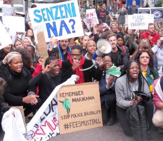South African students in a sit-down protest outside the South African embassy demanded an end to police brutality against protesting students in South Africa