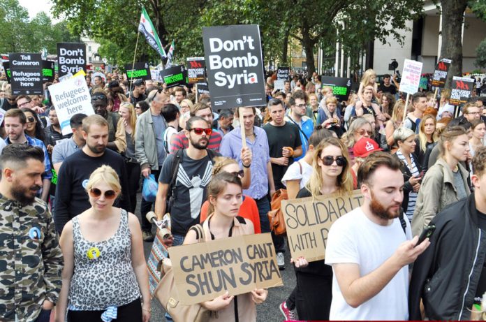 Tens of thousands marched on September 12th to welcome refugees into Britain and demand that Britain must not bomb Syria