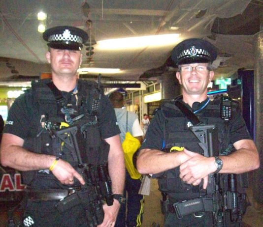 Heavily armed police with sub-automatic MP4 weapons at Liverpool St station in central London