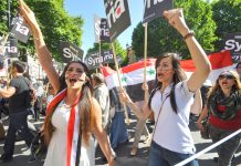 Syrian students on the mass march in central London against the UK bombing of Syria – Cameron wants another vote in parliament