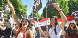 Syrian students on the mass march in central London against the UK bombing of Syria – Cameron wants another vote in parliament