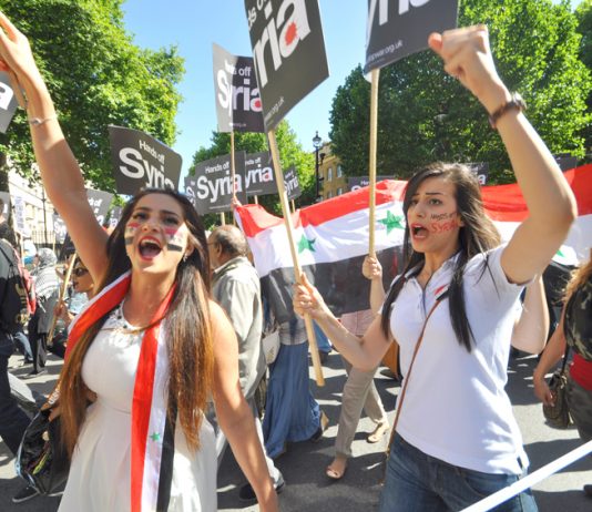 Syrian students on the mass march in central London against the UK bombing of Syria – Cameron wants another vote in parliament