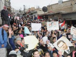 Syrian youth show their support for President Assad