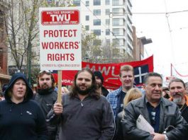 TWU members marching against government attacks – the union is demanding $1 million is returned to it