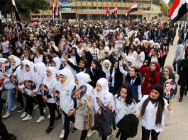 Syrian schoolgirls show their support for President Assad on Army Day