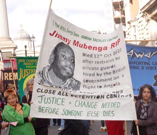 The banner of Jimmy Mubenga a 46-year-old Angolan who died after being forcibly restrained by G4S guards as he was being deported on a flight to Angola in October 2010