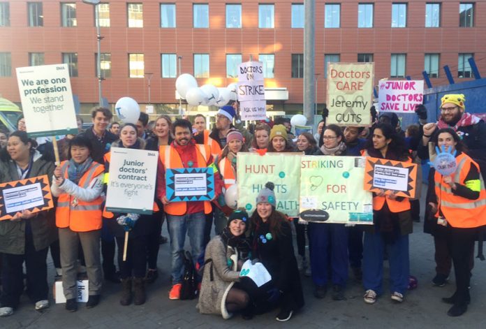 CAM STOCKS (far right in hat) joins junior doctors, nurses and supporters on the picket line outside the Royal London Hospital in Whitechapel, east London during last Tuesday’s strike
