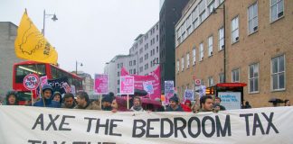 ‘Axe the Bedroom Tax’ banner on a march for more council homes in London