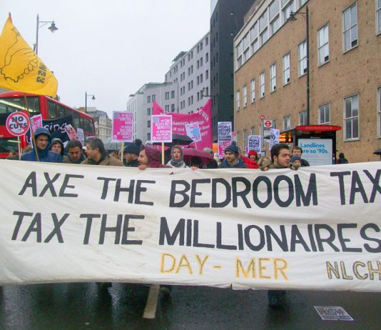 ‘Axe the Bedroom Tax’ banner on a march for more council homes in London