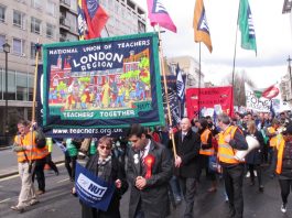 Striking NUT teachers marching in central London against government cuts and privatisation