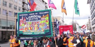 Striking NUT teachers marching in central London against government cuts and privatisation