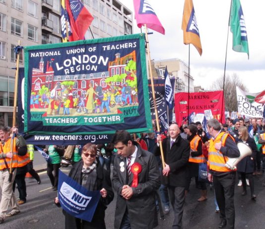 Striking NUT teachers marching in central London against government cuts and privatisation