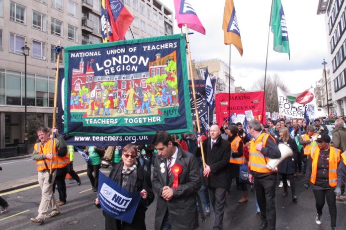 Striking NUT teachers marching in central London against government cuts and privatisation