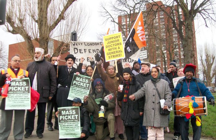 A strong and determined mass picket at Ealing Hospital yesterday morning vowed that action will be taken to stop the closure