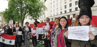 Syrians in London demonstrate at Downing Street after the British government denied them the right to vote in the Syrian elections in June 2014