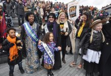 HELEN PANKHURST, great-granddaughter of suffragette founder, Emmeline (centre left, in hat) next to RACHEL HOLMES  (centre, author of ‘Eleanor Marx: A Life’) with the crowd at the ‘Walk in Her Shoes’ rally