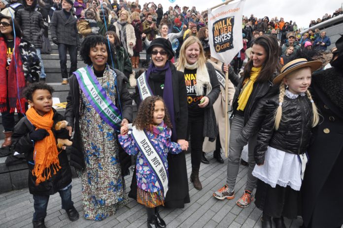 HELEN PANKHURST, great-granddaughter of suffragette founder, Emmeline (centre left, in hat) next to RACHEL HOLMES  (centre, author of ‘Eleanor Marx: A Life’) with the crowd at the ‘Walk in Her Shoes’ rally